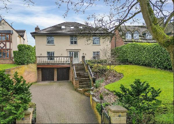 This prominent contemporary family home is located at the heart of the popular village of 