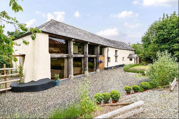A fabulous period barn conversion in the Dartmoor National Park with outbuildings and over