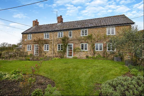 A charming, well presented period house overlooking farmland and situated on the edge of a