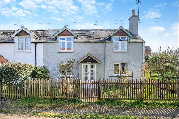 A semi-detached period cottage that offers great potential to extend and a large garden