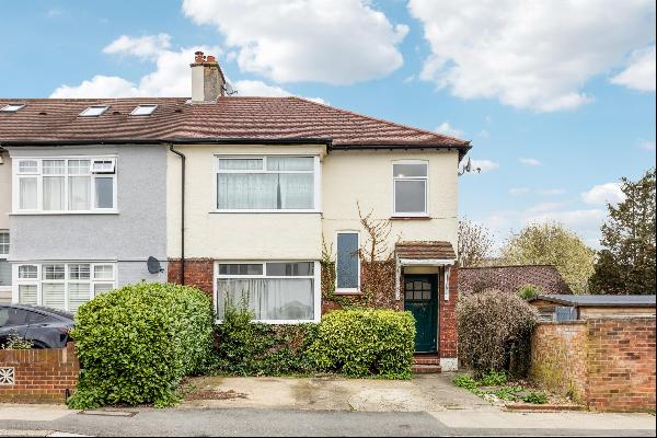 A four bedroom semi-detached house in need of modernisation on a quiet tree-lined resident