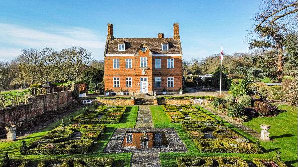 A substantial 17th-century house with beautiful gardens in an attractive parkland setting.
