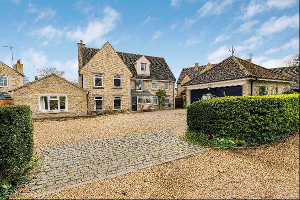A substantial family house hidden in the heart of a thriving Cotswold village near Burford