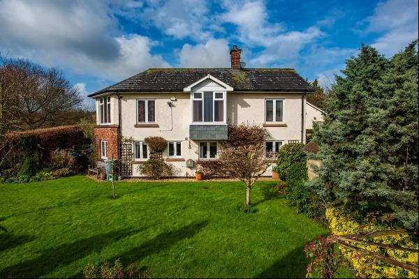 A charming family home in a peaceful, rural setting with gorgeous, southerly views over un