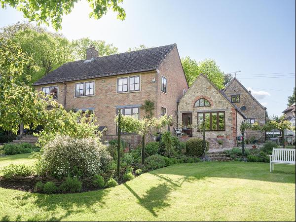 A beautifully positioned edge of village home with secondary accommodation and far reachin