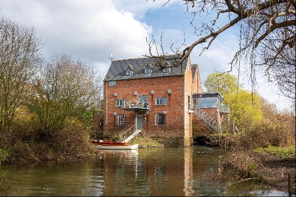 A most lovely detached secluded Mill conversion with river frontage and mooring with attra