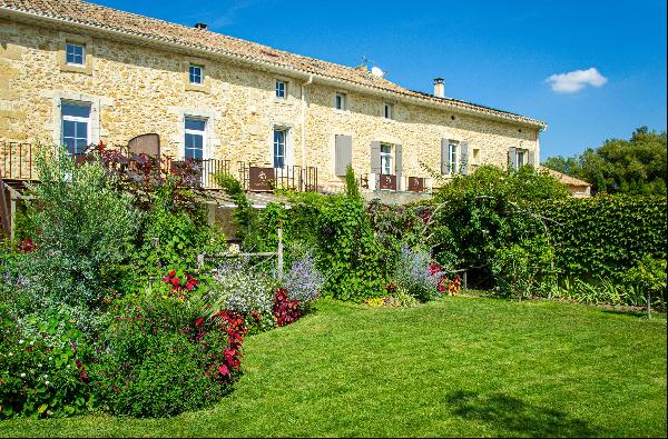 19th century farmhouse with a pool and tree-filled garden for sale near Avignon.