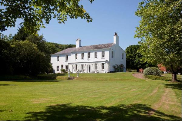 A handsome, Grade II listed, Georgian country house with versatile outbuildings, paddocks 