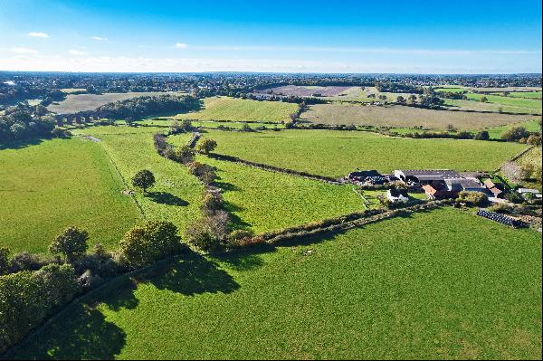An arable and grassland farm on the banks of the River Colne situated in a strategic locat