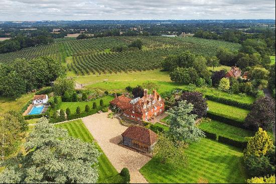 A wonderful Grade II listed country house with a barn conversion and stabling, set in the 