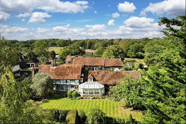 A Grade II Listed Tudor farmhouse with a self contained annex and separate barn in Chipper