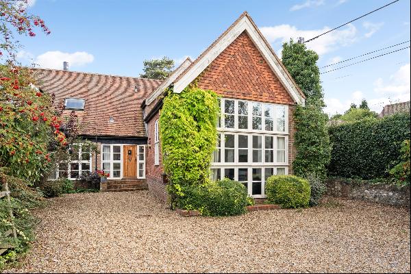 Exceptional family barn conversion with lovely vaulted rooms on the edge of this popular h