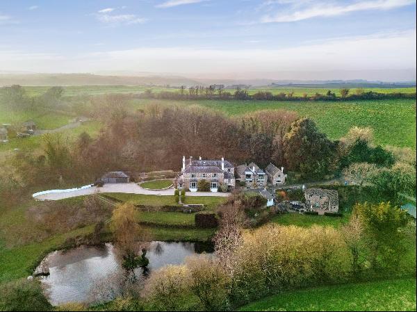 An imposing period manor house in excellent order and set in excess of 9 acres of Devon Co