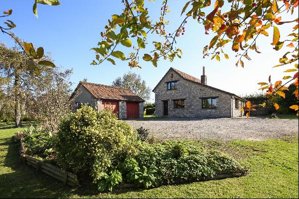 A picturesque detached barn conversion with adjoining paddock and stables situated in a ru
