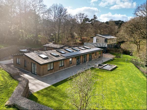 A stylishly appointed detached barn conversion with five bedrooms, in a sought-after villa
