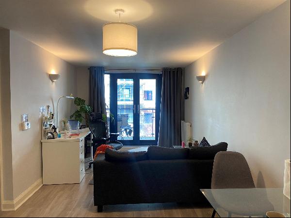 A spacious, third floor, one-bedroom apartment with a balcony located in the centre of Bri