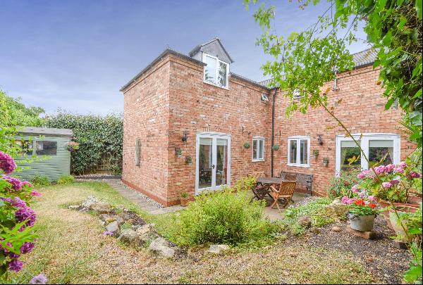 A converted three bedroom coach house in Stratford-upon-Avon with private parking.