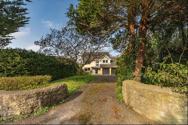 A detached 1960s family home with drive, garage and gardens in a great Bath location.