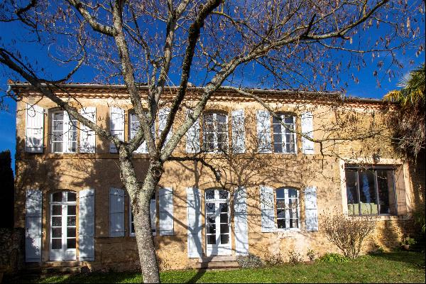 18C townhouse in historic village with gardens and garage.