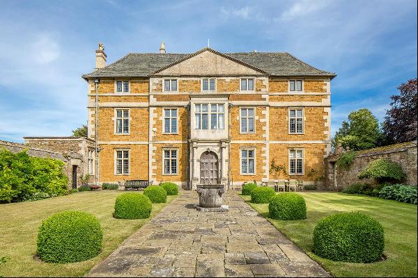 An exceptional Listed Country house set in formal grounds, parkland and two substantial Ga