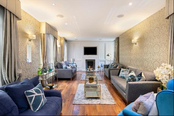 A substantial townhouse with roof terrace, available to let in the heart of Mayfair, W1J.