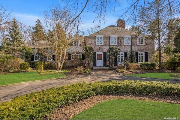 Marked by an elegant and impressive approach, this stately 5BR/4.55 bath Georgian Colonial