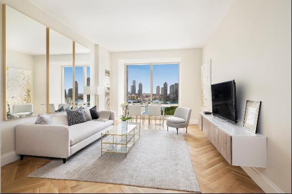 Welcome Home to this luxurious 1 Bedroom, 1.5 Bath residence with outstanding East River a