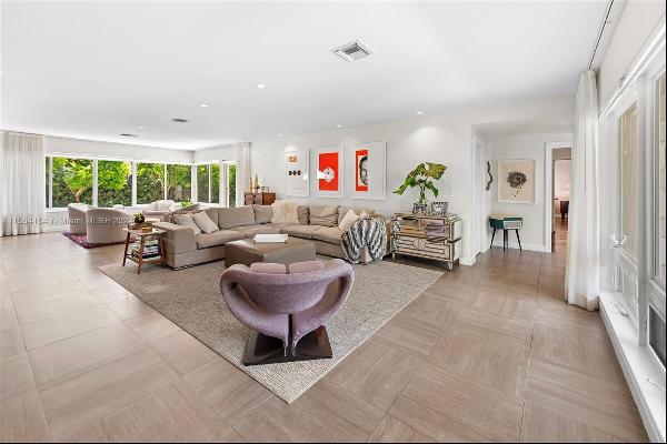 Welcome to this spacious 5-bed, 3-bath home in Miami Beach, where indoor and outdoor livin