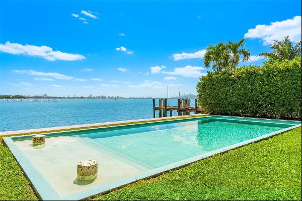 Discover downtown skyline views and the allure of 1660 Bay Dr, a remarkable bay-front prop