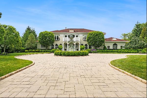 A captivating blend of Hamptons luxury and European elegance on 1.5 pondfront acres in Sou