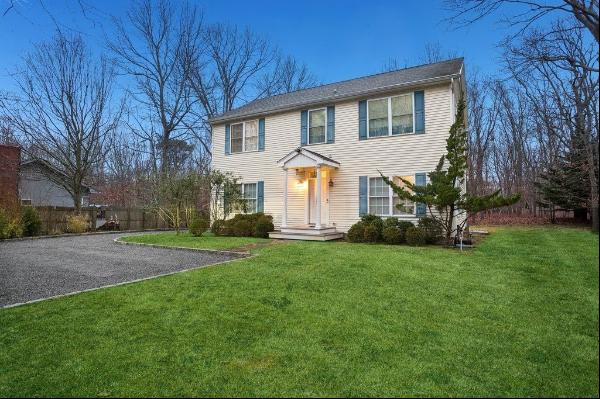 Step into this clean 5 bedroom four bath Center Hall Colonial structure on a full half acr