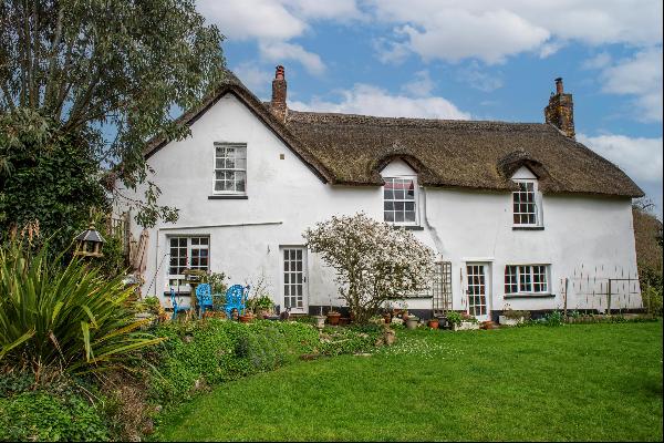 A charming 17th century cottage with a separate one bedroom cottage set in just under two 