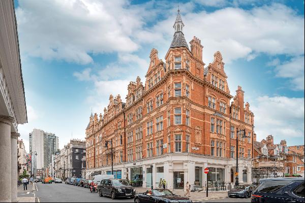 A beautiful two bedroom unmodernised flat with views along South Audley Street in Mayfair.