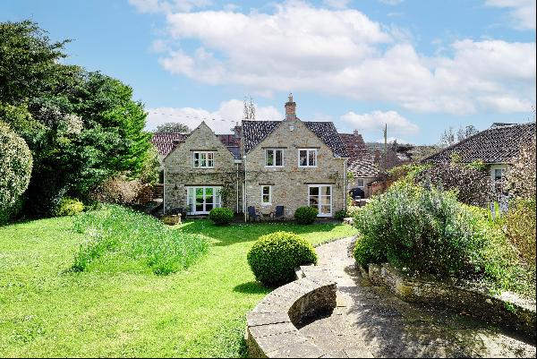 A charming period well-presented and extended cottage with detached annexe and orchard sit
