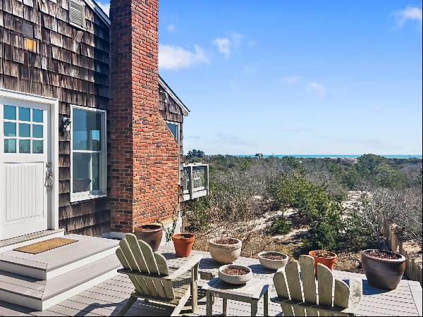 Located in the Amagansett Dunes is this very stylish three bedroom, two bath cottage.Very 