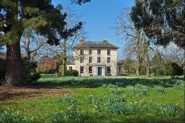 A secluded Grade II listed village house, set in 24 acres of beautiful gardens and grounds