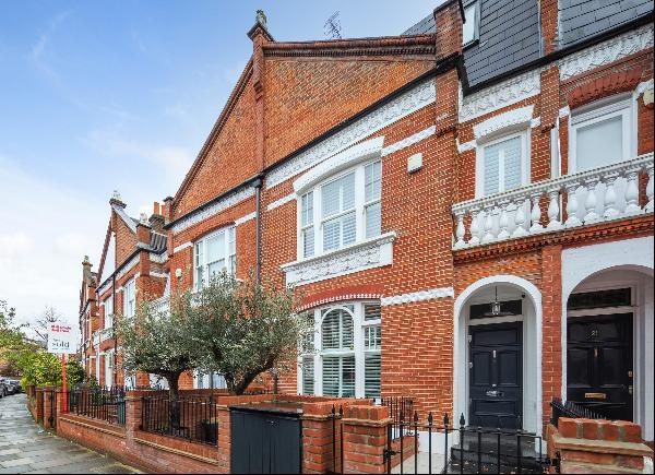 A beautifully finished five bedroom house with a larger than average 50 foot landscaped ga