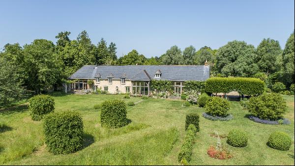 An exquisitely designed country house surrounded by about 82 acres of picturesque grounds 