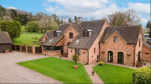 A beautifully presented barn conversion set in at the foot of the Cotswold escarpment.