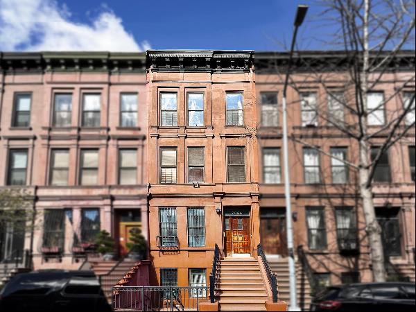 <div><p><em>Located in the culturally rich Central Harlem, this multifamily townhouse pres
