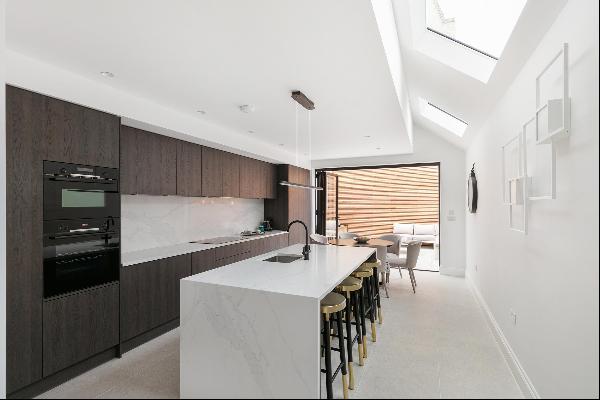 Presenting an exquisite four-bedroom family residence, meticulously refurbished throughout