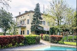 Exclusive 19th-century villa with garden and pool.