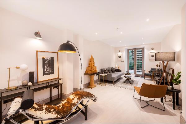 An exquisite newly refurbished and interior-designed garden apartment with a private garde