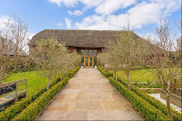 A wonderful, restored Grade II listed detached barn set within a collection of individual 