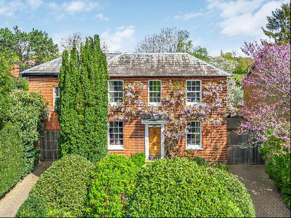 An elegant double fronted Georgian house with a wonderful garden extending to 65 ft approx