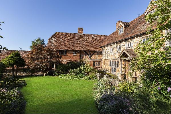 A stunning Grade II listed farmhouse with extensive outbuildings and over 15 acres of land