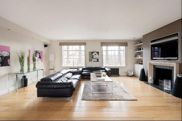 A three bedroom apartment to let on High Street Kensington, W8.