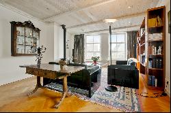 Very charming sunny canal apartment with rooftop terrace, elevator, and parking!