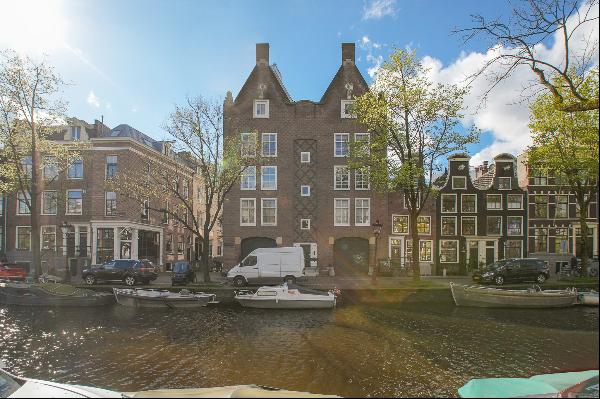 Very charming sunny canal apartment with rooftop terrace, elevator, and parking!