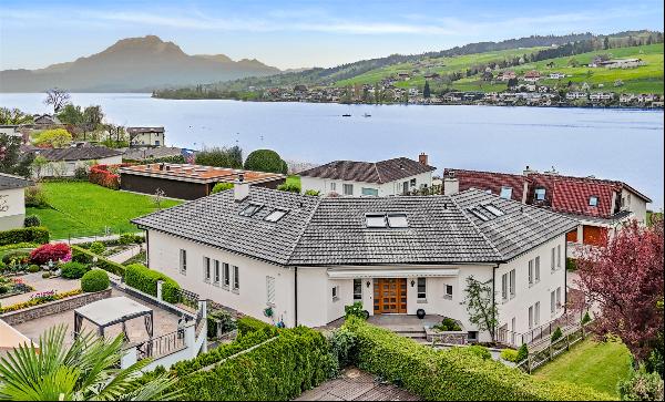 Quietly situated villa with pool and views over Lake Lucerne.